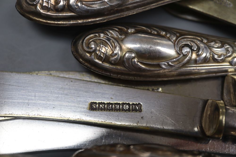 Five pairs of Persian white metal handles fruit knives & forks and twelve silver handled cake knives.